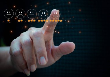 Businesswoman pressing smiley face emoticon on virtual touch screen. Customer service evaluation concept.