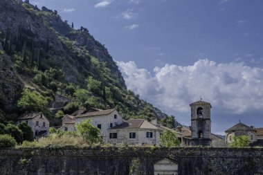 Kotor, Montenegro, August 3, 2024. Montenegro, Kotor. View of the old town from an old stone bridge over the Scurda River with an entrance gate clipart