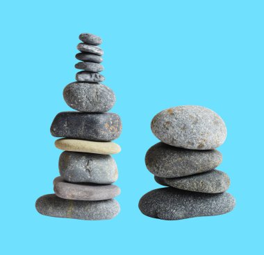 Balancing stone or rock isolated, natural pebble with clipping path, no shadow in blue background clipart