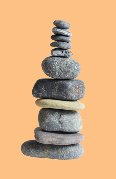 Balancing stone or rock isolated, natural pebble with clipping path, no shadow in cream background