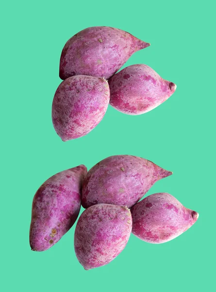 Purple sweet potato isolated with clipping path, no shadow in green background, healthy food