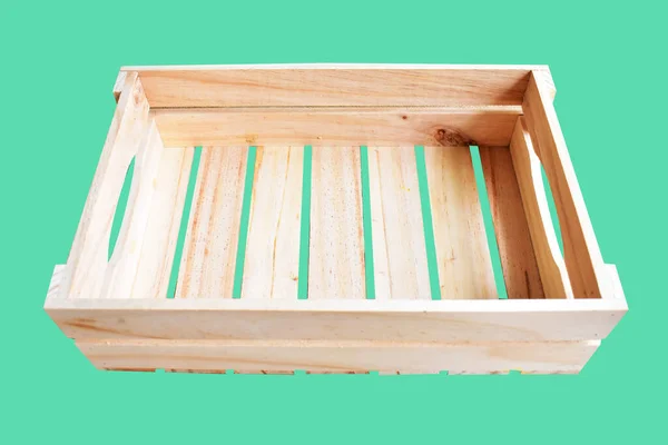 Wooden box or crate isolated with clipping path, no shadow in green background