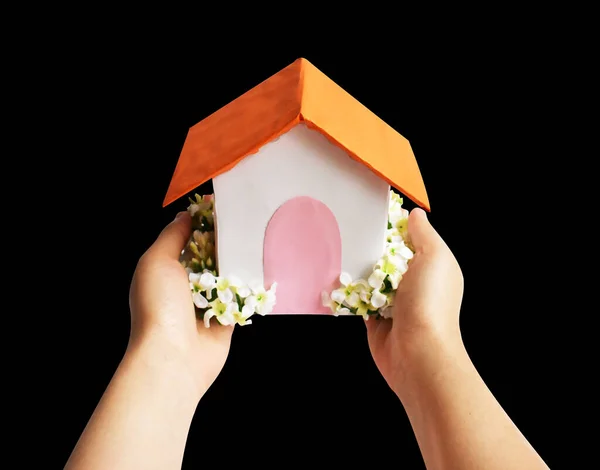Handmade paper house isolated with clipping path, no shadow in black background