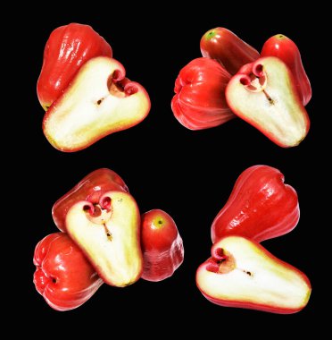 Kırpma yolu ile izole edilmiş kırmızı su elma meyvesi siyah arka planda gölge yok, sağlıklı tropikal meyve