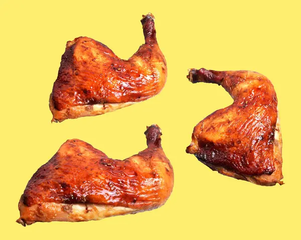 Grilled chicken quarter leg with sauce isolated, clipping path, no shadow in yellow background