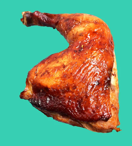 Grilled chicken quarter leg with sauce isolated, clipping path, no shadow in green background