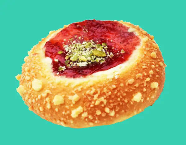 Danish pastry bun with strawberry jam isolated, no shadow with clipping path in green background, bakery pastry