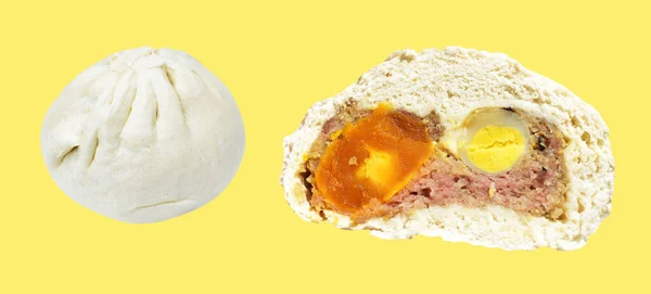 Baozi or Chinese steamed meat bun half isolated filled with pork meat and salted egg yolk and quail eggs in cream background with clipping path and no shadow