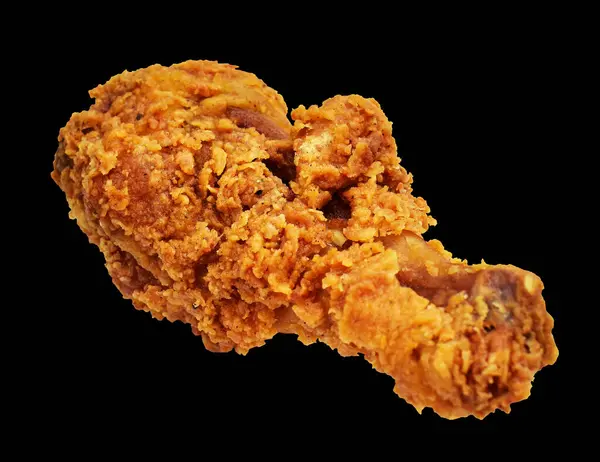 Fried chicken leg drumstick crispy and spicy isolated chicken with clipping path, no shadow in black background, fast food