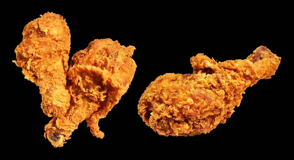 Fried chicken leg drumstick crispy and spicy isolated chicken with clipping path, no shadow in black background, fast food