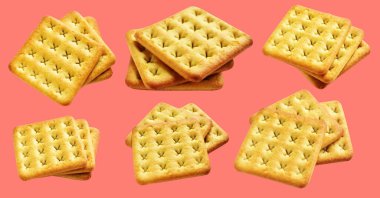 Square crackers isolated or biscuits, butter cookies with clipping path, no shadow in pink background