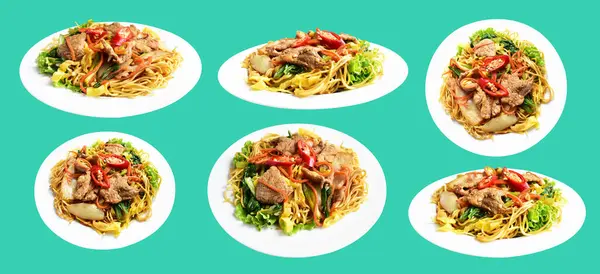 Stir fried noodles dish with pork meat, carrot, onion, lecture, chili pepper, fried egg in green background, no shadow with clipping path, cooking ingredient