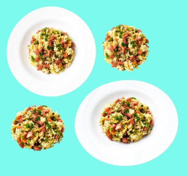 Kırpılmış pirinç, yeşil arka planda gölge yok. Çin pilavı, karışık sebze, yumurta ve sosis (Yangzhou tarzı).)