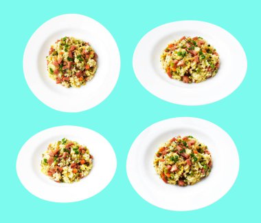 Kırpılmış pirinç, yeşil arka planda gölge yok. Çin pilavı, karışık sebze, yumurta ve sosis (Yangzhou tarzı).)