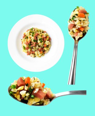 Kırpılmış bir kaşık kızarmış pirinç, yeşil arka planda gölge yok. Çin pilavı, karışık sebze, yumurta ve sosis (Yangzhou tarzı).)