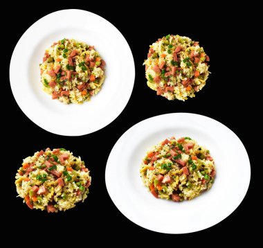 Kırpılmış pirinç, siyah arka planda gölge yok. Çin pilavı, karışık sebze, yumurta ve sosis (Yangzhou tarzı).)