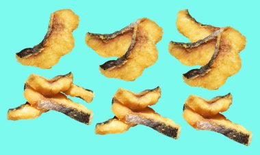 Kızarmış fileto balığı kırpma yolu ile izole edilmiş, yeşil arka planda gölge yok.