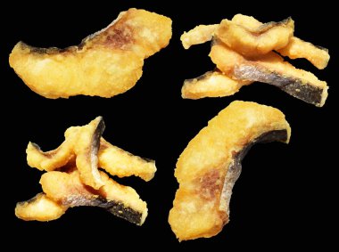 Kızarmış fileto balığı kırpma yolu ile izole edilmiş, siyah arka planda gölge yok.