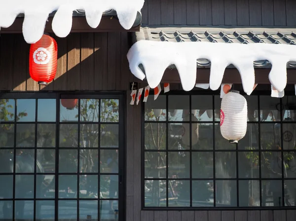 Japanese lantern hung in front of Japanese Restaurant, Japanese text on lantern is 