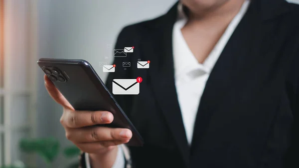 Businessman checking email on mobile phone. New email notification ideas for business email communication and digital marketing. The inbox receives electronic message notifications. internet technology