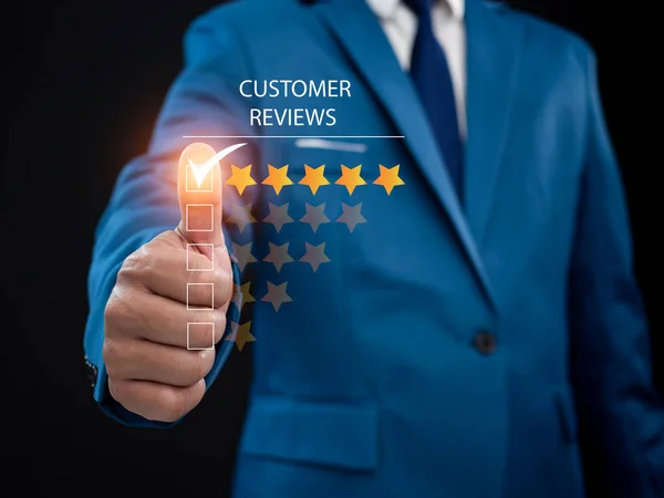 Businessman presses his finger on the check mark to rate five stars. Customer satisfaction survey concept. Service experience ratings. Evaluation of customer service product quality. Satisfaction reviews. The best quality.