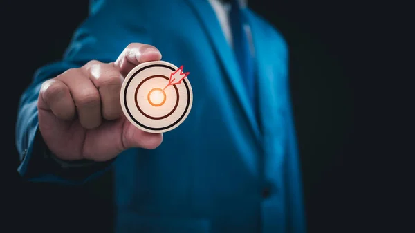 Businessman holding to the target icon . Business concept. management concept business planning concept.