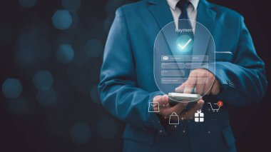 Digital banking network, internet payment, financial technology.  Businessman pointing his finger at icons on virtual screen, online shopping and payment via mobile banking apps.