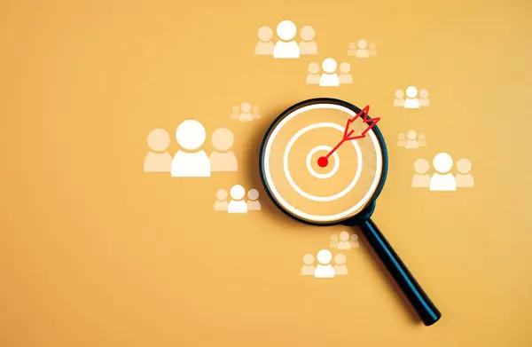 Customer group icons in a magnifying glass placed on a yellow background represent the selection of business goals, target customers. Marketing plans and strategies, customer-centric strategies.