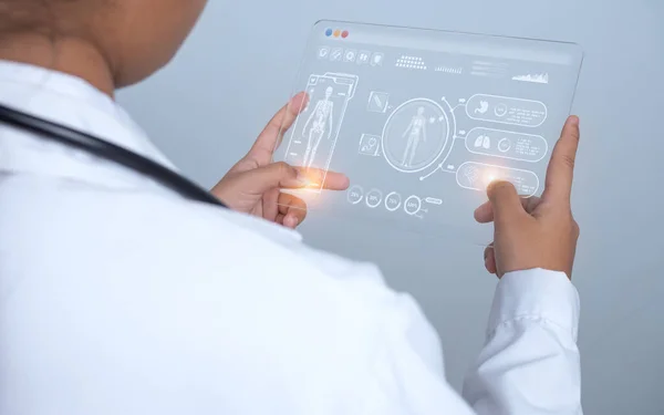 Doctor is using finger of touching screen for medical diagnostic analysis on modern virtual screen network connection. Medical technology concept.