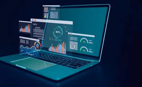 Laptop computer on dark background and dashboard for business analysis. Data and management system with KPIs and indicators connected to databases for finance, technology, operations, marketing, sales analysis.