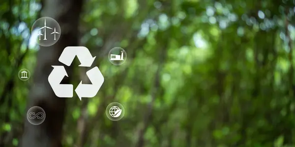 Recycle symbol on green bokeh background. Ecological and save the earth concept. An ecological metaphor for ecological waste management and a sustainable.