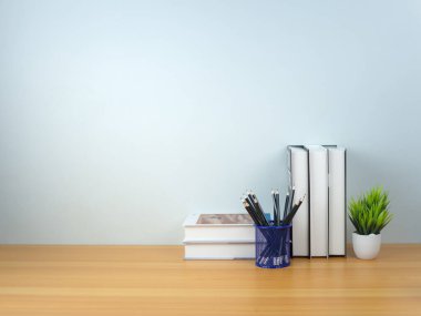 Okul konseptine, tahta masa çalışma alanı ve beyaz duvar üzerindeki kitap yığınına ve kaleme, okumak, kitap okumak ve sınavlara hazırlanma kavramına geri dönelim..