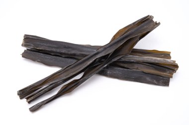 Dried kombu seaweed or laminaria isolated on white background. Japanese food