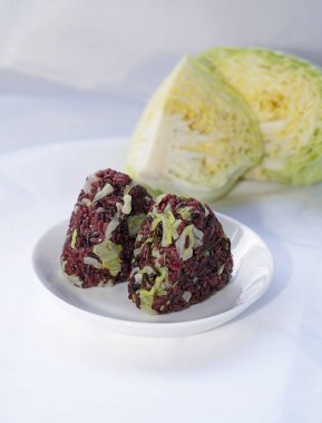 Riceberry rice with cabbage,salt kombu onigiri.Homemade healthy food. clipart