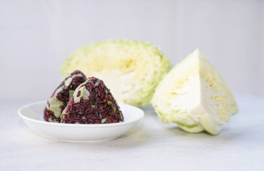 Riceberry rice with cabbage,salt kombu onigiri.Homemade healthy food. clipart