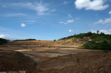 The Impact of coal mining on the environment. The mining location was abandoned without reclamation. Location: Sangatta, East Kalimantan/Indonesia.                                                               clipart