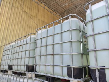 IBC tank container is a container that is used as a means of transportation and can also be used to store liquid loads such as lubricating oil, formic acid to hazardous materials. clipart