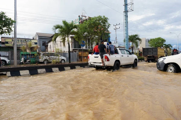 stock image Sangatta, East Kutai, East KalimantanIndonesia - 03 21 2021: Floods hit homes and highways because high rainfall and high tide of sea water