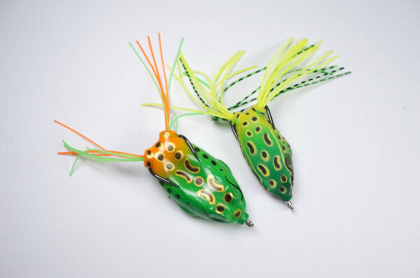Fishing hook with a bayman in the shape of a frog. Fishing bait on white background. Male Hobbies Fishing, Sport  