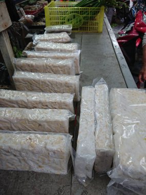 top view, tempe or tempeh in transparent plastic cover