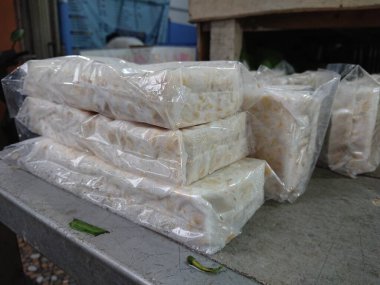 top view, tempe or tempeh in transparent plastic cover