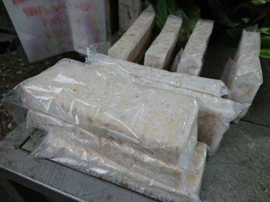 top view, tempe or tempeh in transparent plastic cover