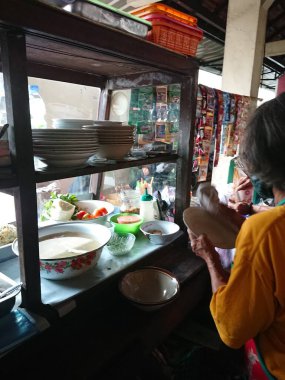 photo editorial, 29 december 2022, indonesia buyer and seller traditional food small restaurant, ngasem market, yogyakarta, indonesia