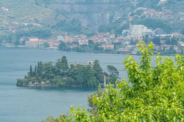 stock image Monte Isola, Italy - 05-06-2022: Aerial view of Loreto Island in the Lake Iseo