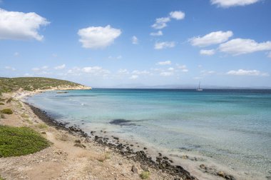 Coaquaddus beach in Sardinia with turquoise sea on a sunny day clipart