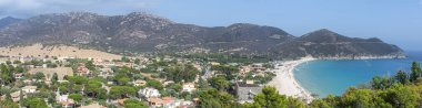 Extra wide Aerial view of Solanas with its beautiful beach with blue and turquoise water clipart