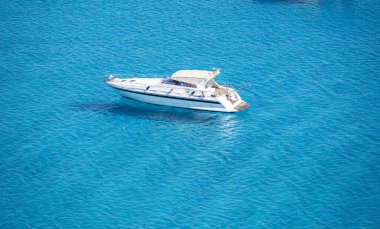 the beautiful Cala Porto Giunco beach in Villasimius with white sand and crystal clear water clipart