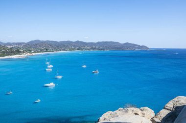 the beautiful Cala Porto Giunco beach in Villasimius with white sand and crystal clear water clipart