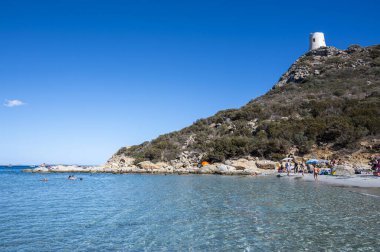 the beautiful Cala Porto Giunco beach in Villasimius with white sand and crystal clear water clipart