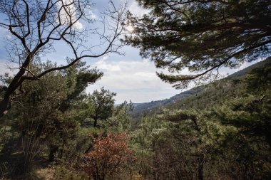 Clouds over the mountains in the Ida Mountains National Park, Turkey. clipart